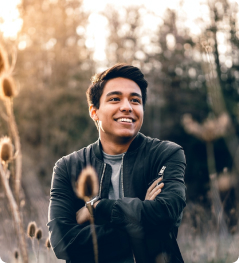 A man in nature, smiling