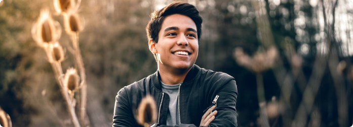 A man in nature, smiling